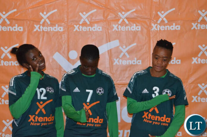 L-R- Defender Catherine Gwangwara, striker Bethel Kondo and winger Alice Moyo after being unveiled by Green Buffaloes Women's Football Club Club in Lusaka yesterday.
