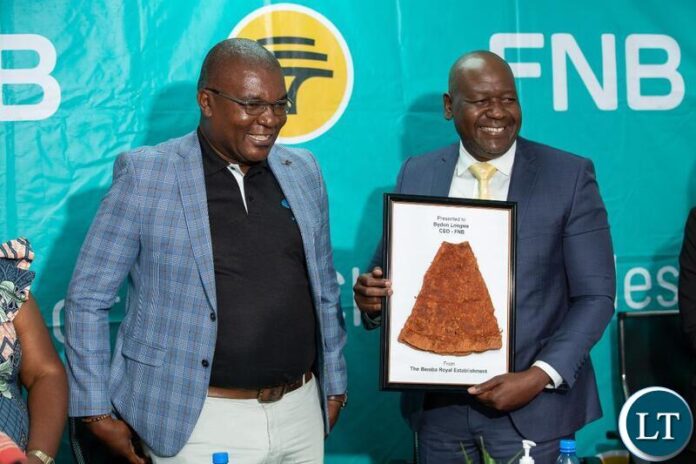 FNB Zambia chief executive officer Bydon Longwe (right) with Ukusefya Pa Ng’wena Traditional Ceremony chairperson, Bwalya Chiteba during the bank’s announcement of the platinum sponsorship of the ceremony slated for August 17 – 19, 2023.