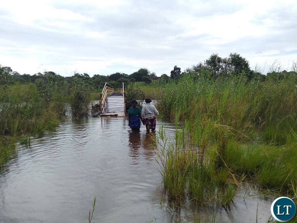 Floods Submerge Bridge in Kasama, Cutting Off Communities